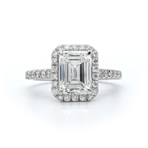 Beautiful 2cts emerald cut Canadian diamond set with a diamond halo and pave band in white gold.
