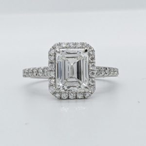 Beautiful 2cts emerald cut Canadian diamond set with a diamond halo and pave band in white gold.